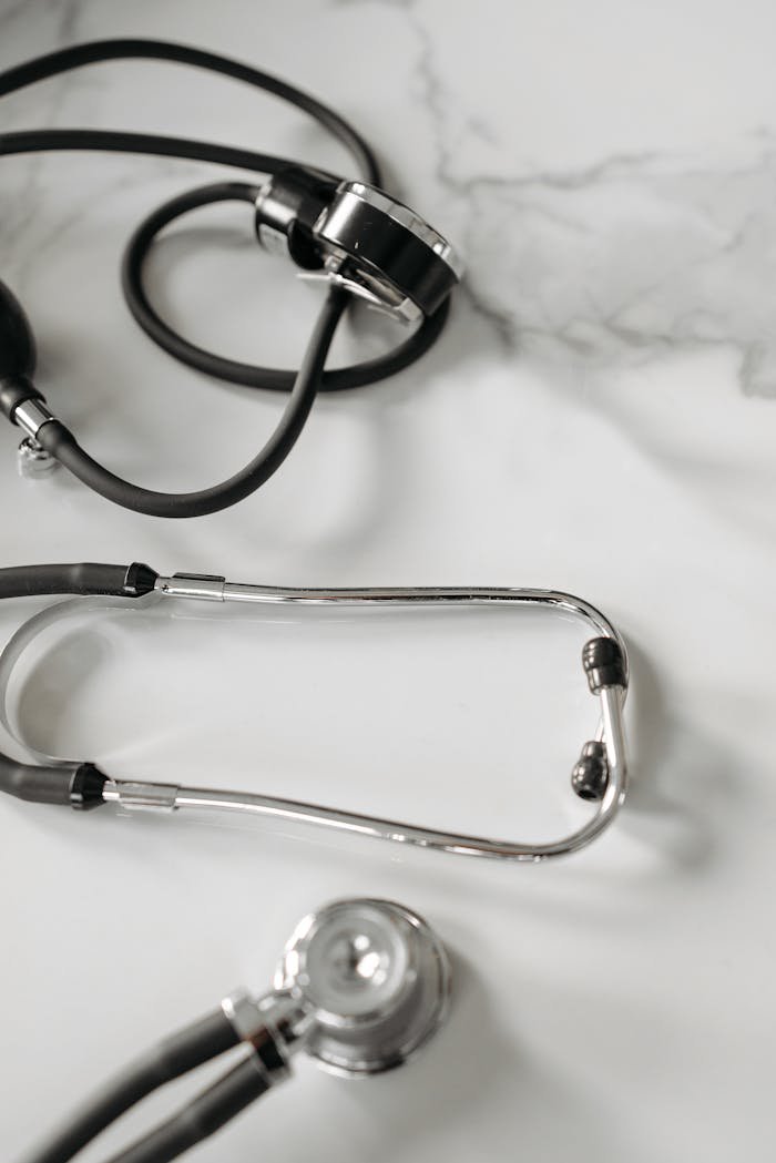 Detailed shot of a stethoscope on a marble background, emphasizing medical themes.